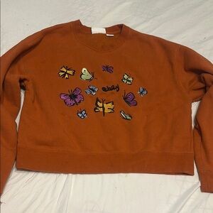 Orange Sweatshirt with Butterfly Design